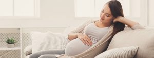 pregnant woman thinking of baby